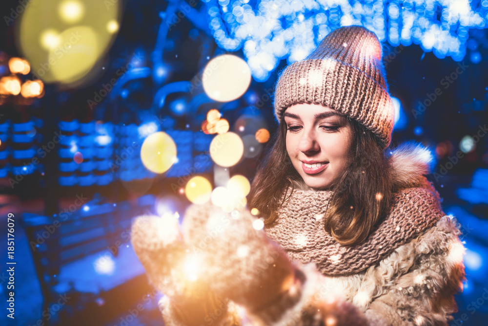 Pretty happy girl on the street with christmas lights Pretty happy girl on the street with christmas lights