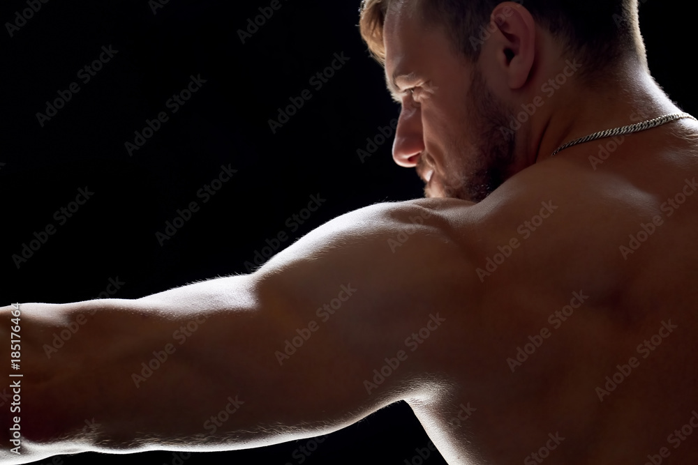Sportsman having workout at gym. Getting in shape and becoming strong. Overcome difficulties and achieve the goal. Sportsman having workout at gym. Getting in shape and becoming strong. Overcome difficulties and achieve the goal.