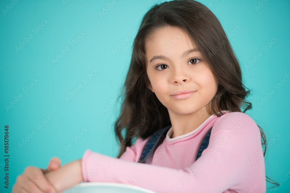 Girl with adorable face on blue background Girl with adorable face on blue background