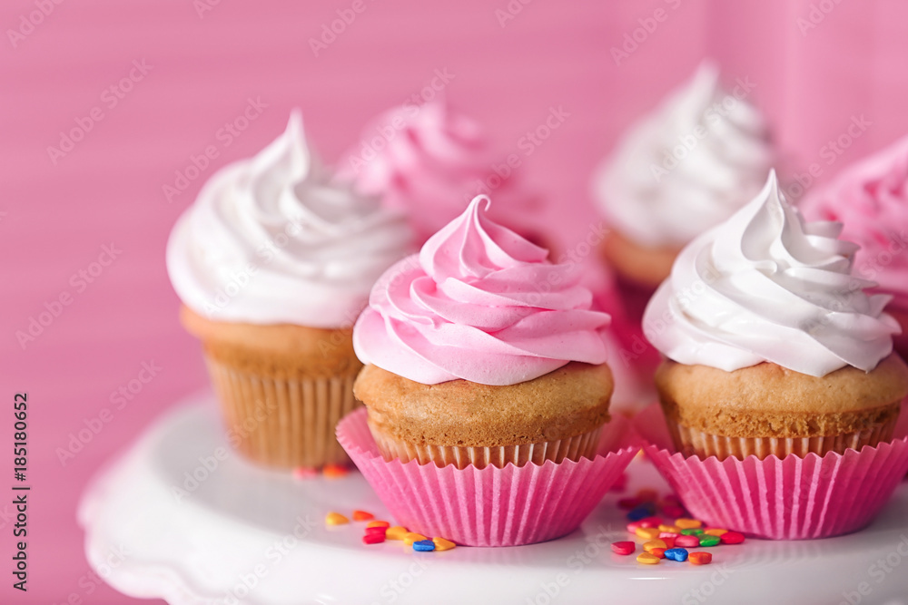 Dessert stand with delicious cupcakes on blurred background, closeup