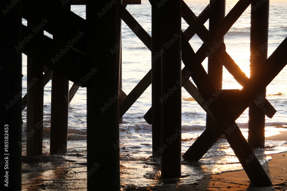 Sunset from under a pier, Orange County California.
