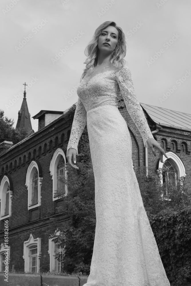 Beautiful bride in a white long dress