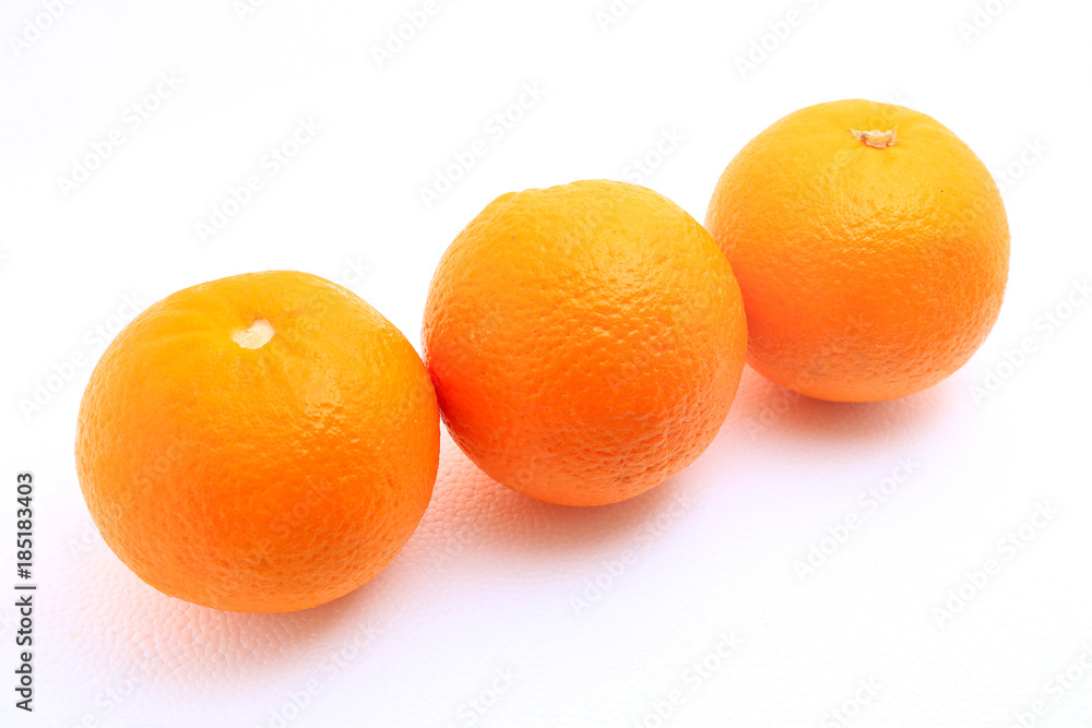 Three mandarin oranges shot over white background Three mandarin oranges shot over white background