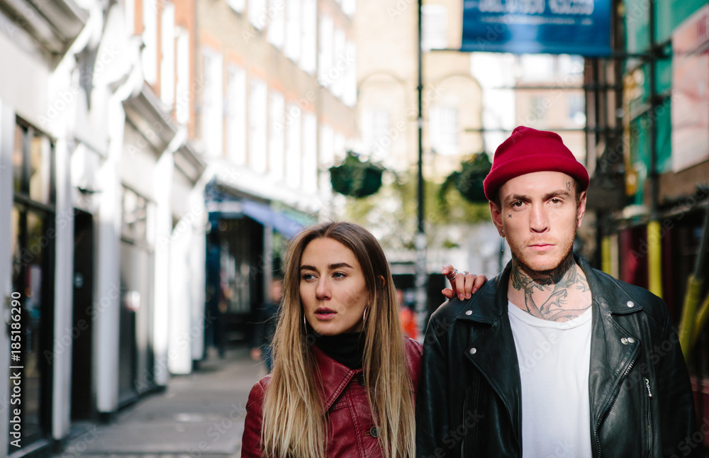 Cool couple wearing leather jackets out in the city. Cool couple wearing leather jackets out in the city.