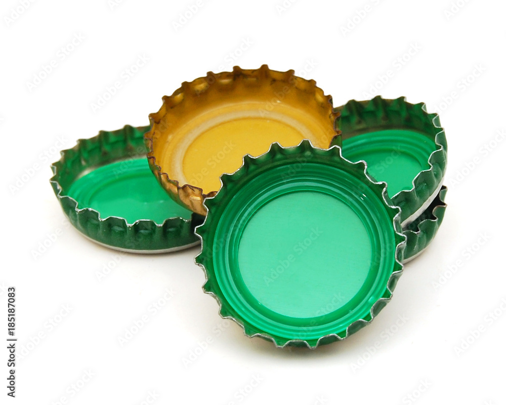 Decorative beer caps on white background