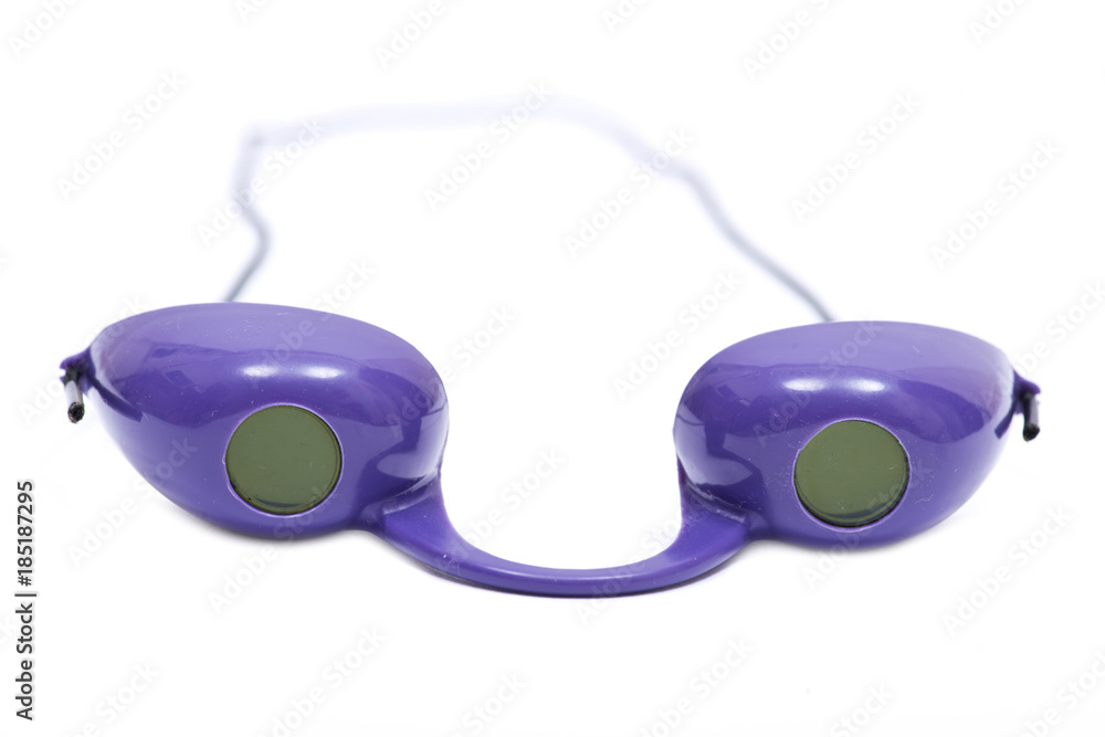 Indoor tanning bed eye UV protection purple goggles isolated on white background - obrazy, fototapety, plakaty 