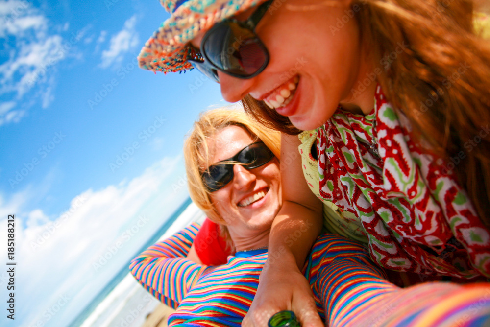 Happy couple in love having fun on beach, smiling and enjoying life Happy couple in love having fun on beach, smiling and enjoying life