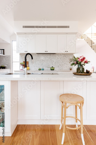 Hamptons styled kitchen with marble herringbone splash back photo