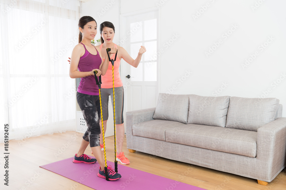healthy slim girl student using resistance band healthy slim girl student using resistance band