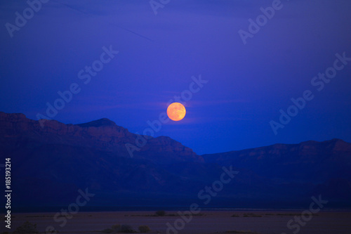Super moon over red mountains