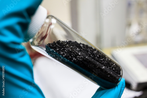 activated carbon or granular in clear bottle is used in air purification, decaffeinate, gold purification, metal extraction, water purification, medicine, sewage treatment, air filters in gas masks