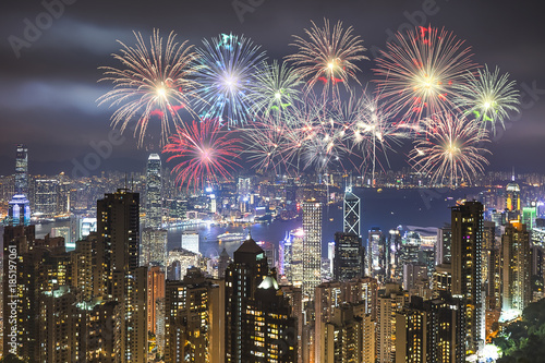 Festive fireworks display over the city of Hongkong at night scene for holiday and New year celebration background.   © Kris Tan