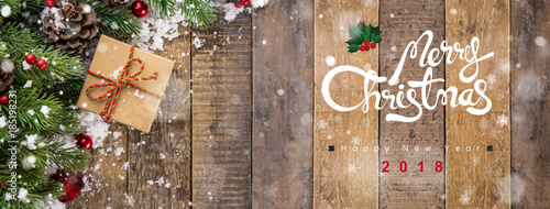 Merry Christmas and happy new year 2018 text on wood banner background
