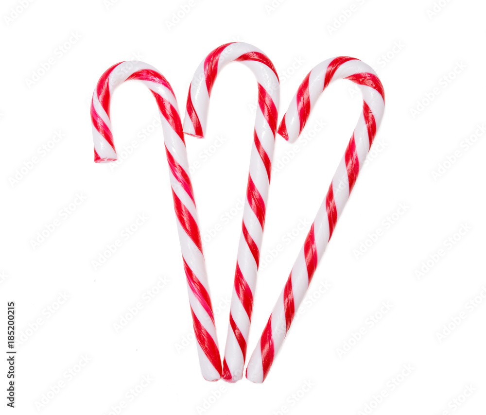 Fototapeta premium Three candy canes isolated on white background