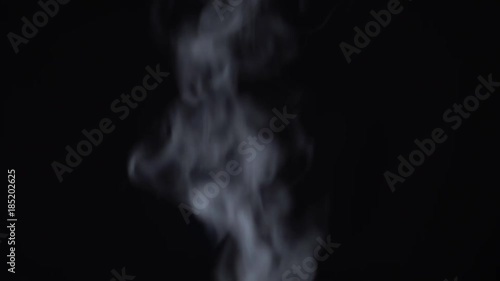 Steam rises on a black background