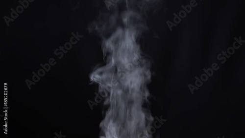 Steam rises on a black background