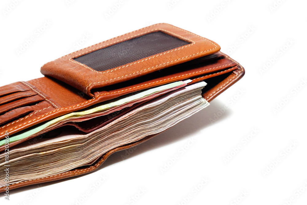 Close up Used Brown Leather Wallet with a full of banknote. Close up Used Brown Leather Wallet with a full of banknote.