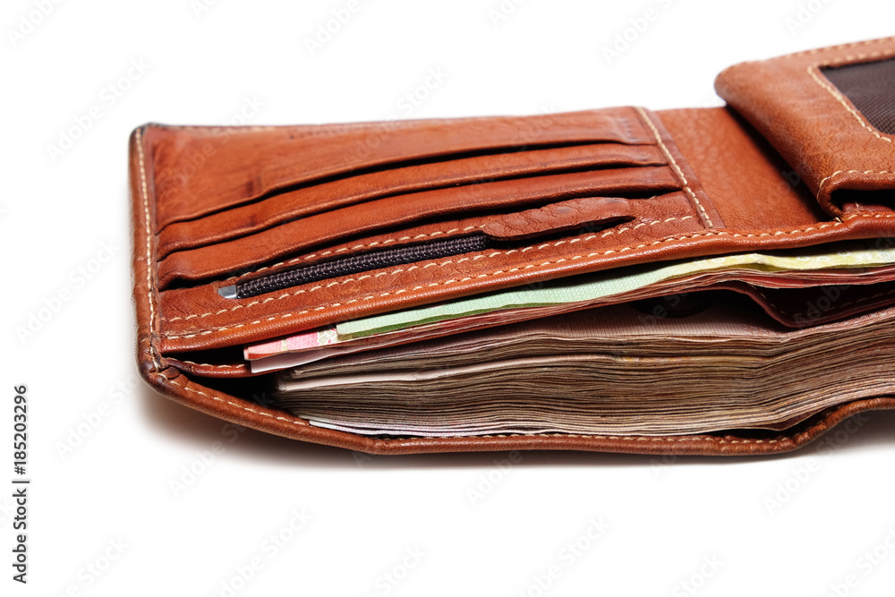 Close up Used Brown Leather Wallet with a full of banknote. Close up Used Brown Leather Wallet with a full of banknote.