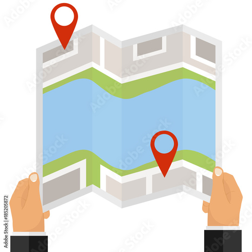 A man holds a map with a destination in his hands. Red mark on the map, location.