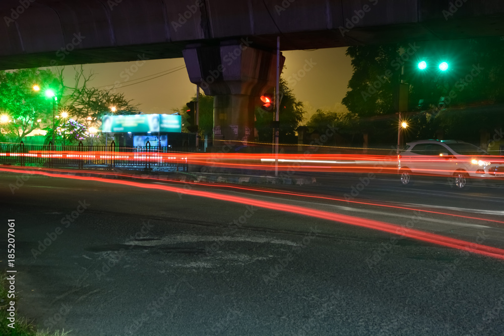 Motion traffic light trail on night of city