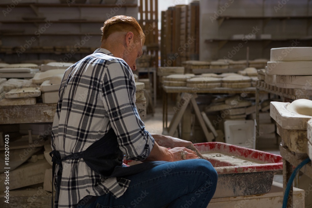 Male potter making a pot Male potter making a pot