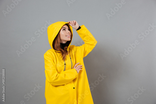 Portrait of a happy girl dressed in raincoat posing © Drobot Dean