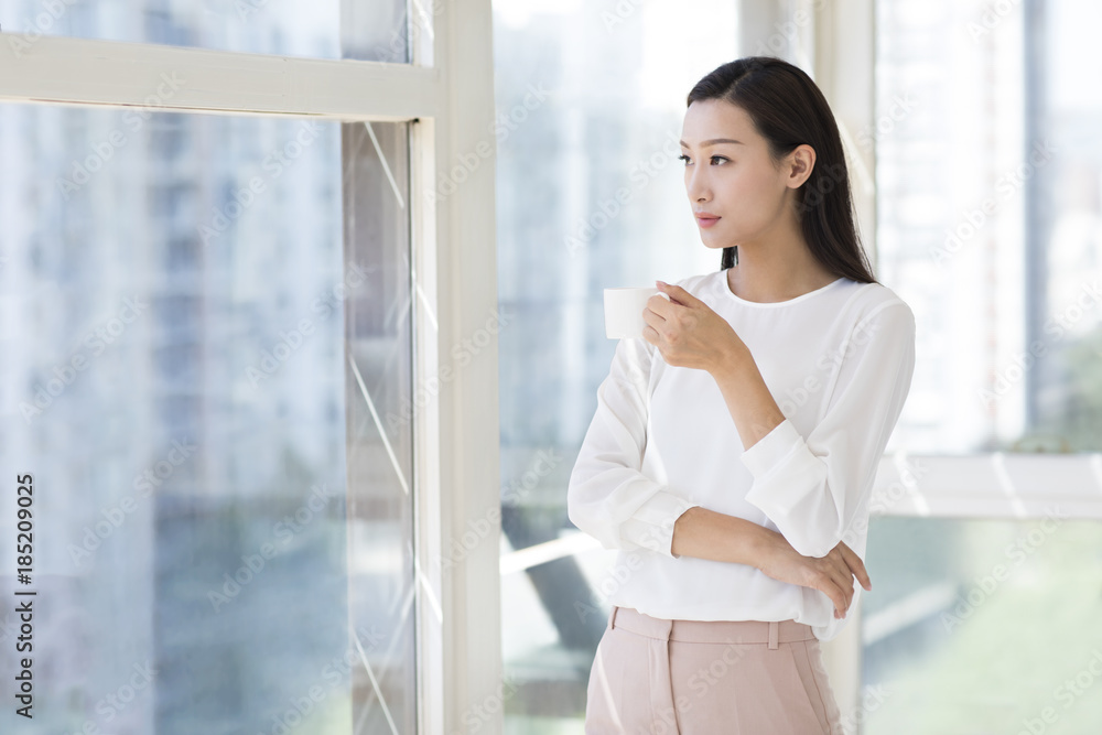 Young woman having coffee