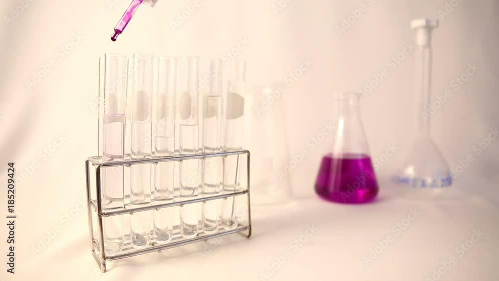 scientist doing chemical testing in laboratory scientist doing chemical testing in laboratory