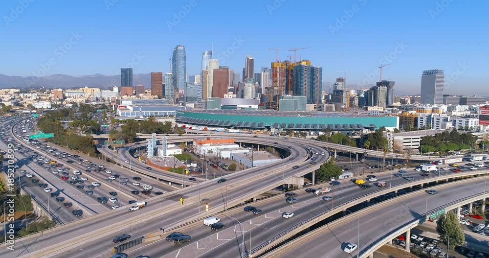 Cinematic urban aerial view of downtown Los Angeles, freeway, interstate and L.A. convention center as seen from the freeway. Cinematic urban aerial view of downtown Los Angeles, freeway, interstate and L.A. convention center as seen from the freeway.