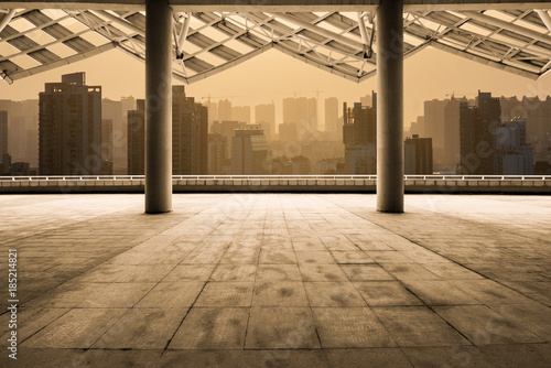 cityscape of modern city at dawn from empty floor