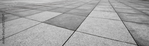Obraz na płótnie Perspective View of Monotone Gray Brick Stone on The Ground for Street Road