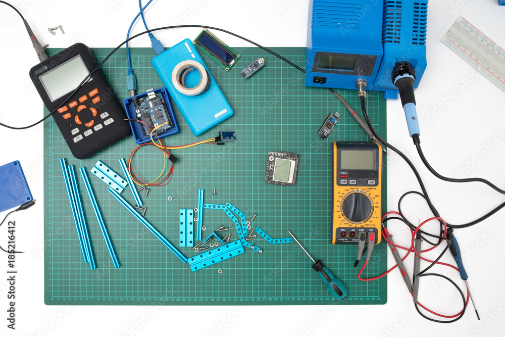 manual assembly of electronic mechanical device from a set of spare ...
