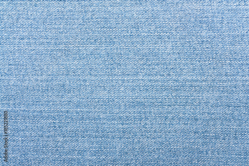 Light blue jeans texture. Denim fabric background.