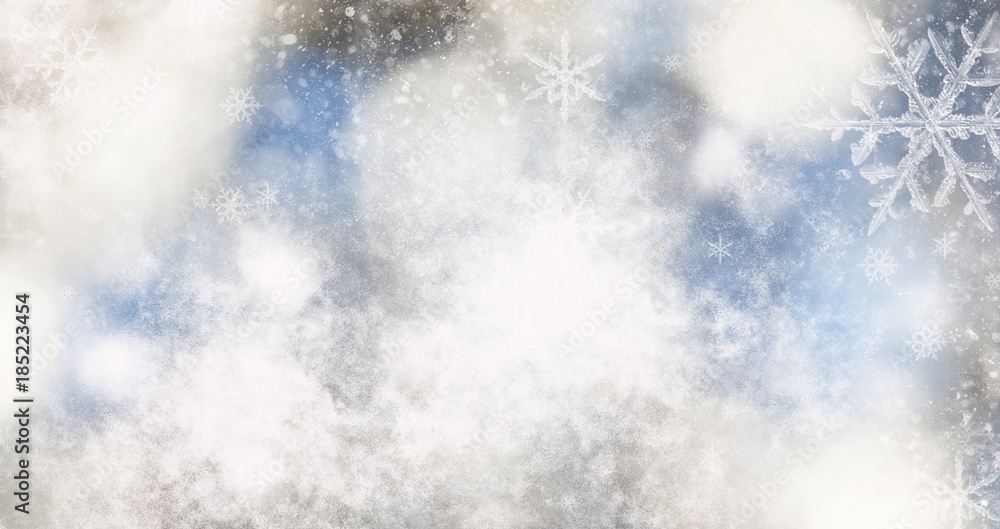 blurred bokeh background of christmas lights and snowflakes blurred bokeh background of christmas lights and snowflakes
