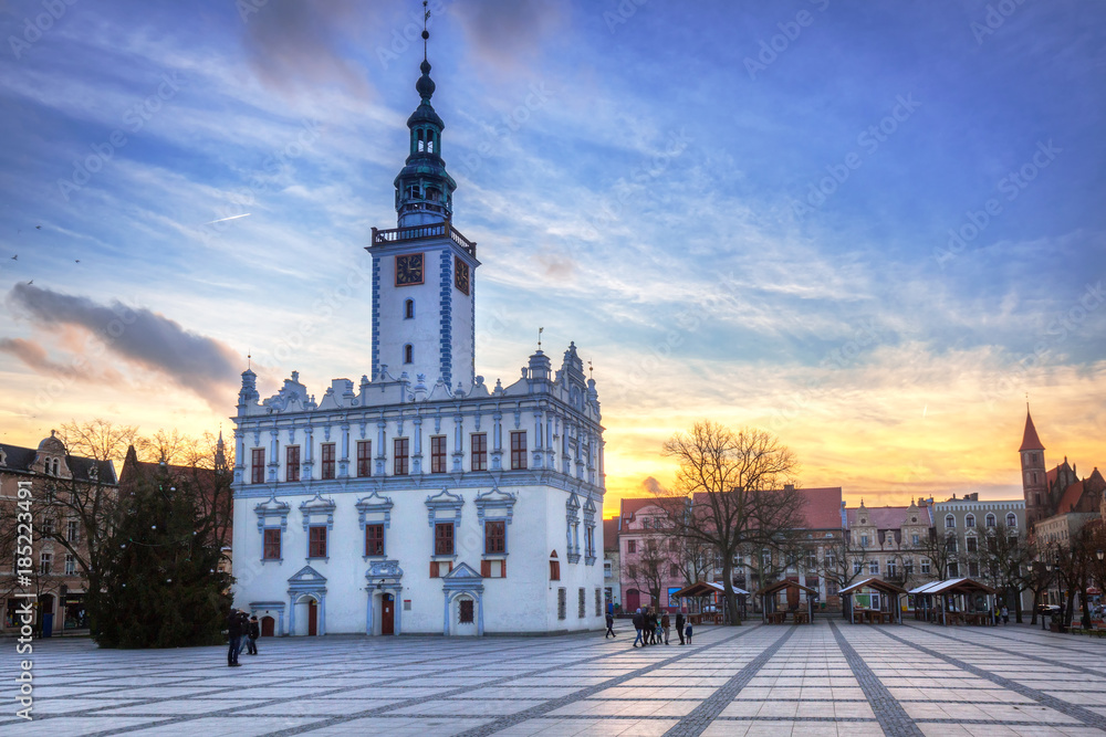 Old town square with historical town hall in Chelmno at sunset, Poland