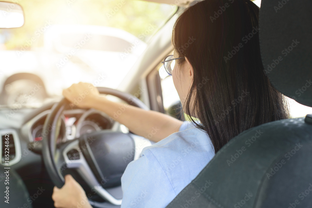 Asian woman driving car with feeling happy Asian woman driving car with feeling happy