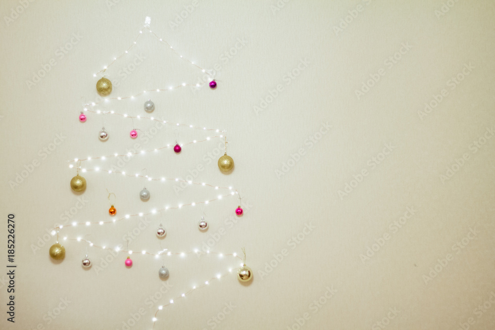 Obraz premium tree made of garland decorated with Christmas balls