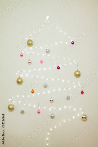 tree made of garland decorated with Christmas balls