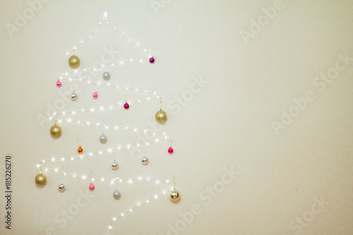 tree made of garland decorated with Christmas balls