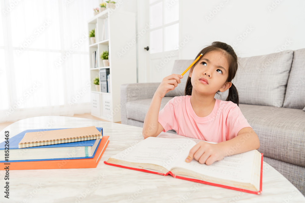 little girl studying school class textbook at home little girl studying school class textbook at home