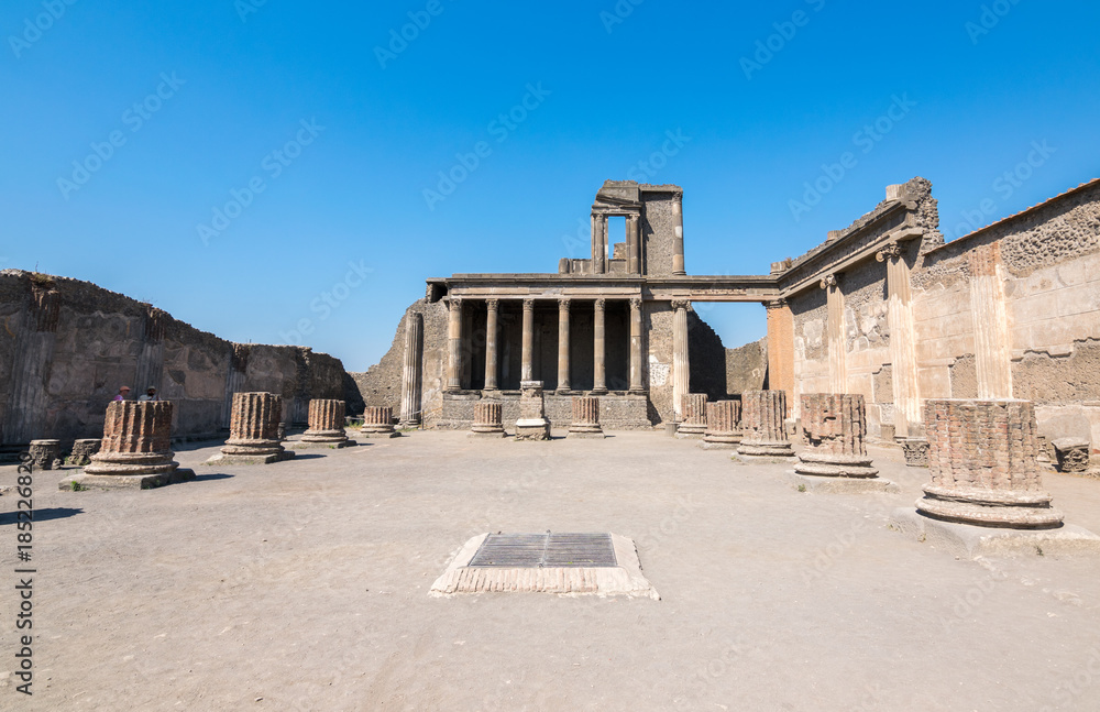 Walking around the ruins and the empty streets of the ancient antique site of Pompeii destroyed by Mount Vesuvius in AD 79, Naples, Campania, Italy, Europe