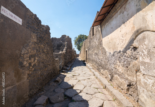 Walking around the ruins and the empty streets of the ancient antique site of Pompeii destroyed by Mount Vesuvius in AD 79  Naples  Campania  Italy  Europe