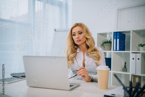 beautiful businesswoman working at laptop in office