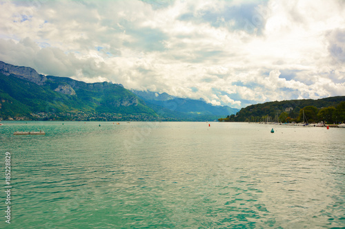 Lake Annecy is surrounded by mountains and is located in the department of Haute Savoie in France. View of the embankment of Annecy