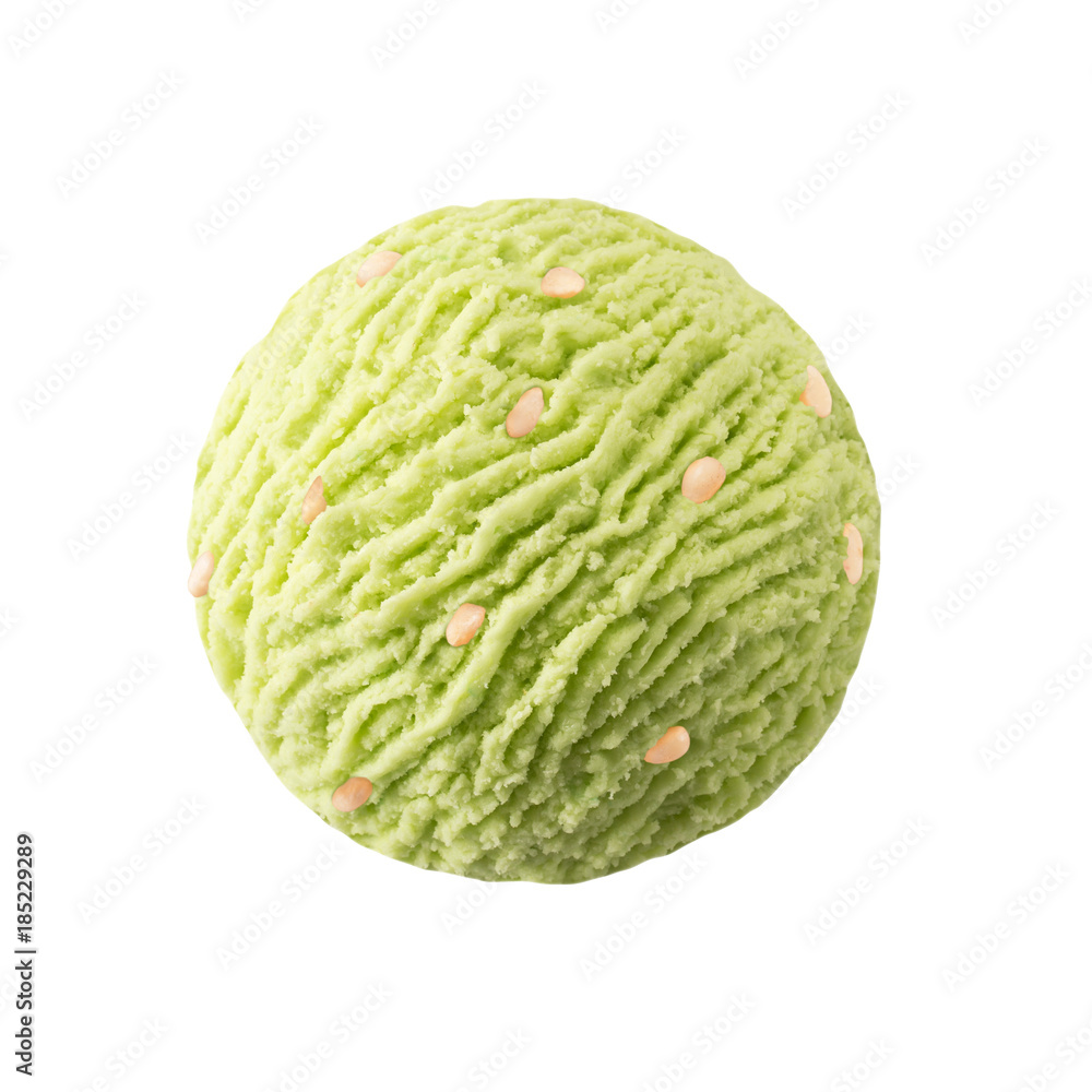 Obraz premium Pistachio ice cream scoop with pine nut pieces, Green pistacchio kiwi sorbet ice-cream ball with pine nuts