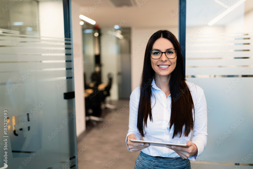 Portrait of successful businesswoman holding digital tablet Portrait of successful businesswoman holding digital tablet