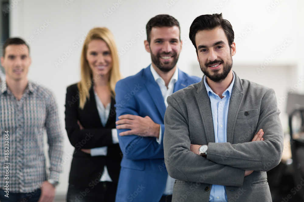 Successful team of young perspective businesspeople in office Successful team of young perspective businesspeople in office