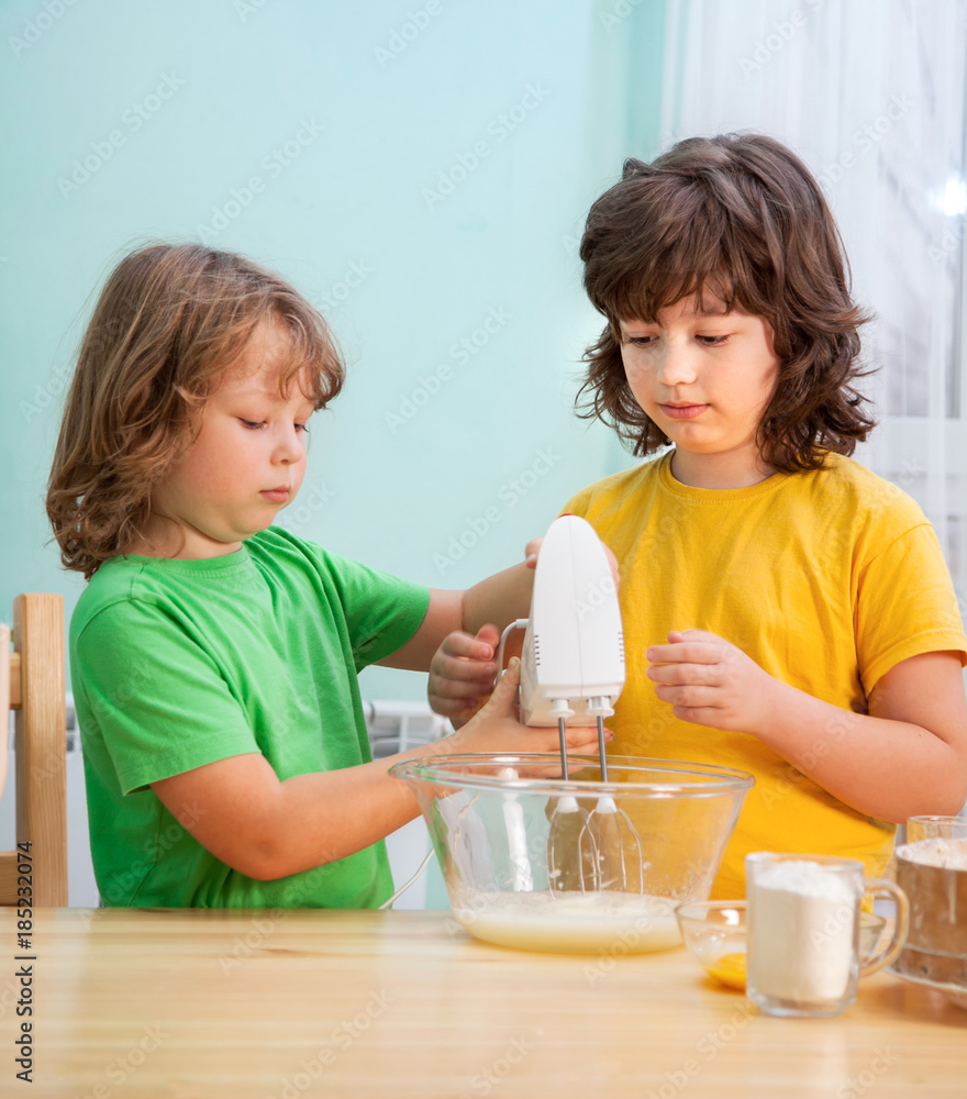happy family funny kids are preparing the dough, bake cookies in the kitchen happy family funny kids are preparing the dough, bake cookies in the kitchen