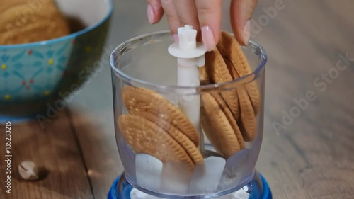 Food processor chop the cookies into crumbs. photo