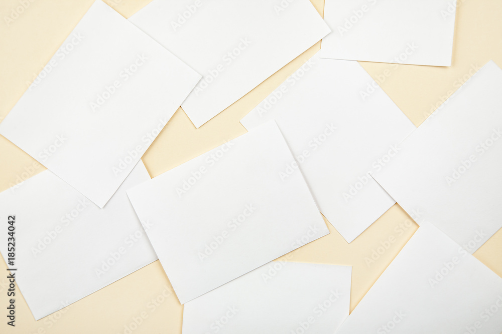 Blank white paper cards on a soft color background, business cards mockup